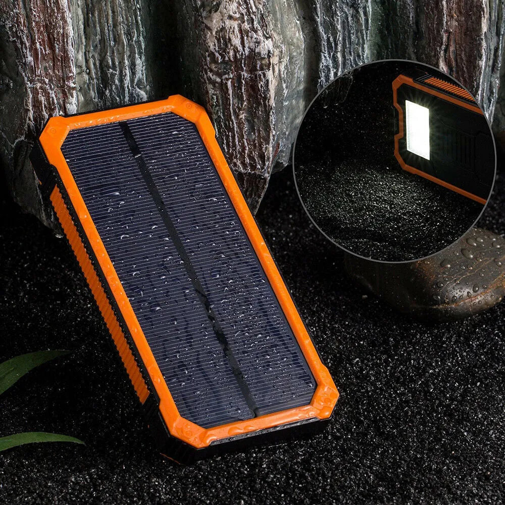 Orange 20000mAh solar power bank showing solar panel and multiple USB ports.