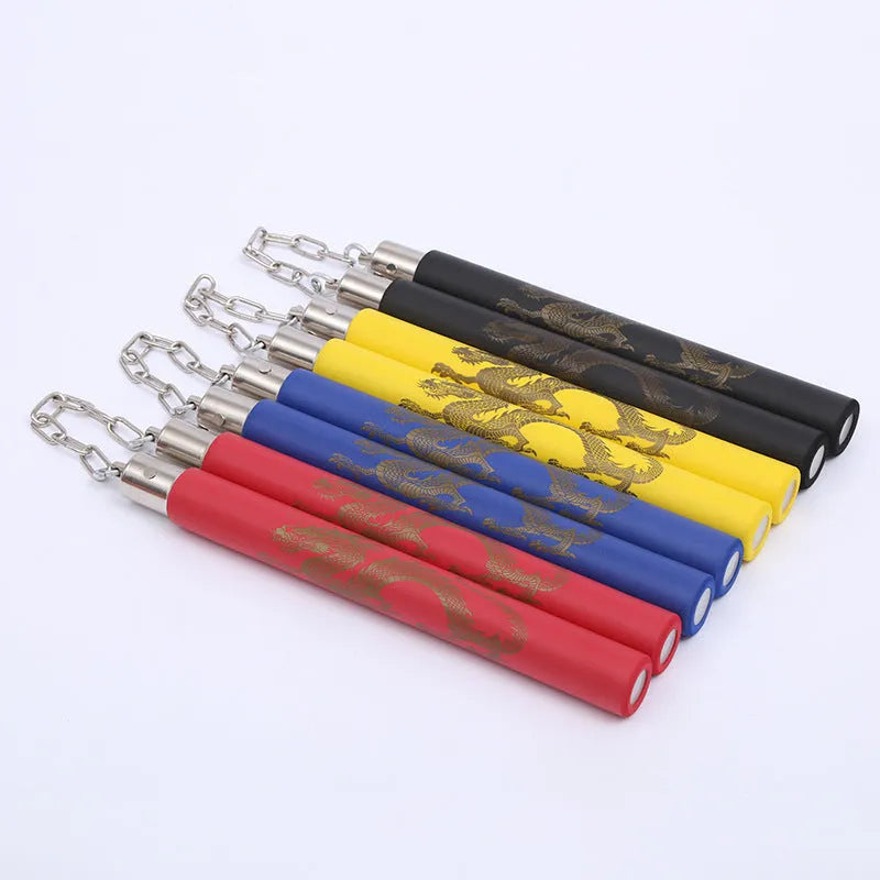 Red sponge nunchaku with two foam-covered sticks connected by a metal chain on a white background.
