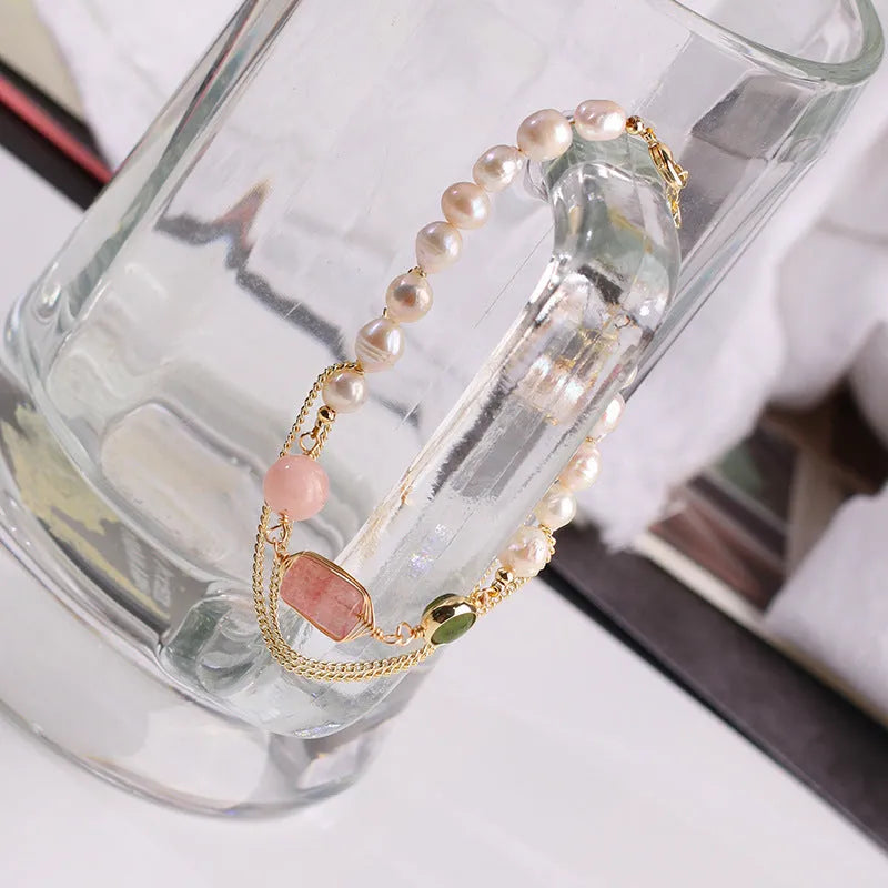 Pink freshwater pearl bracelet with strawberry crystal charms in geometric arrangement