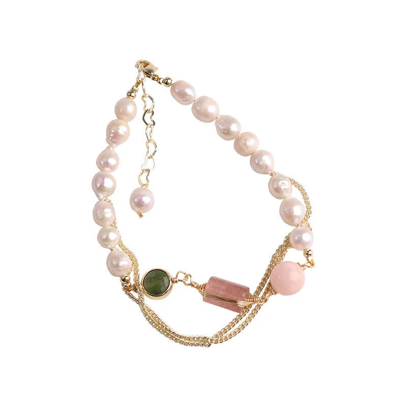 Pink freshwater pearl bracelet with strawberry crystal charms in geometric arrangement