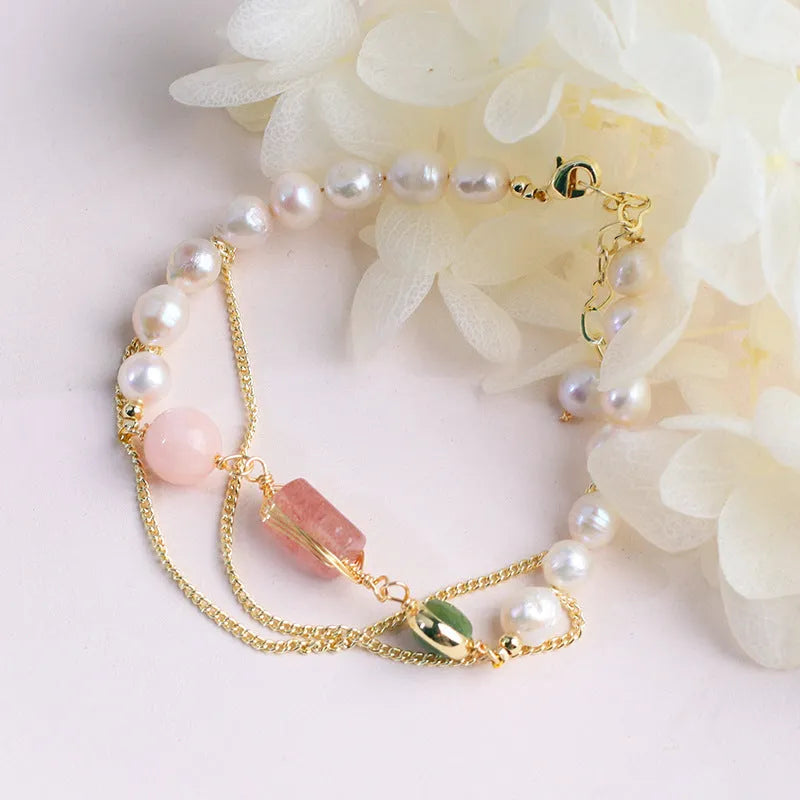 Pink freshwater pearl bracelet with strawberry crystal charms in geometric arrangement
