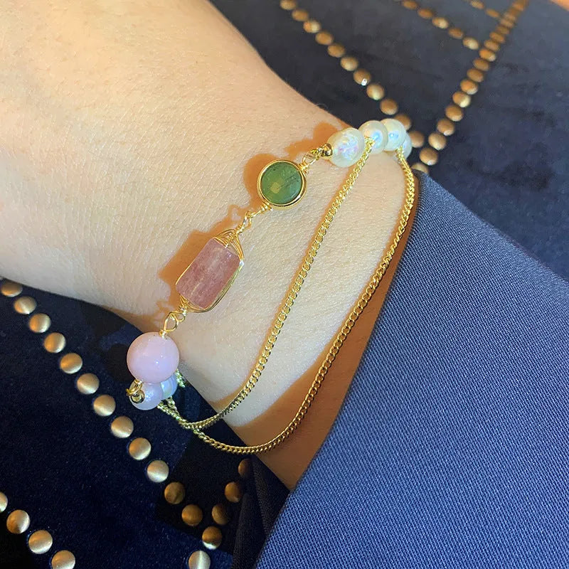 Pink freshwater pearl bracelet with strawberry crystal charms in geometric arrangement