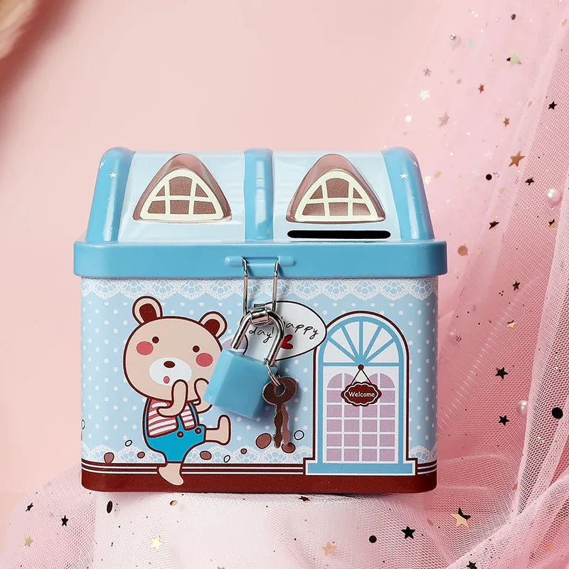 Blue house-shaped tinplate piggy bank for coin storage on a desktop