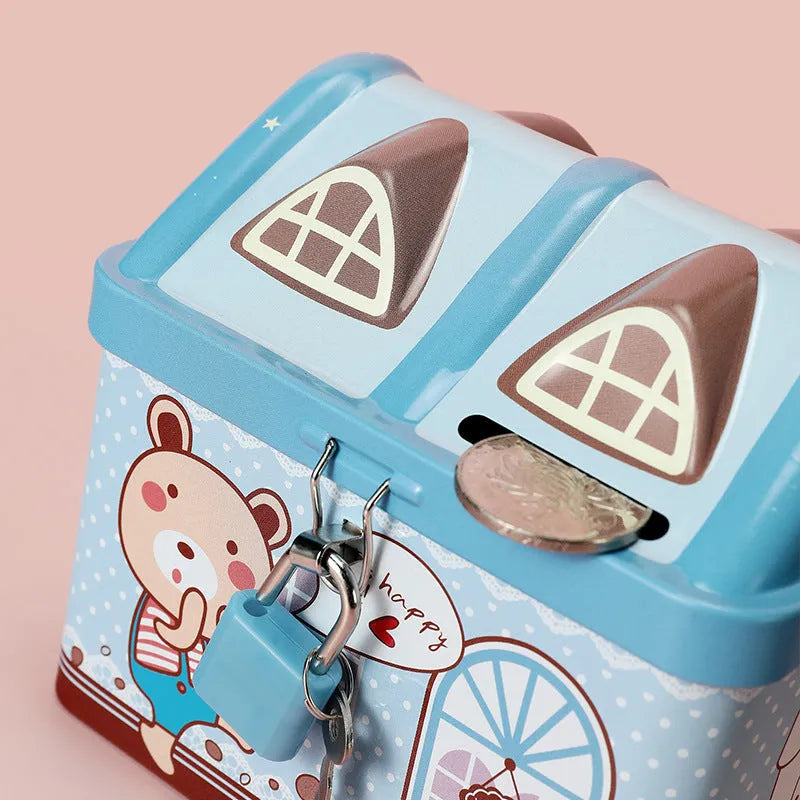 Blue house-shaped tinplate piggy bank for coin storage on a desktop