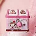 Blue house-shaped tinplate piggy bank for coin storage on a desktop
