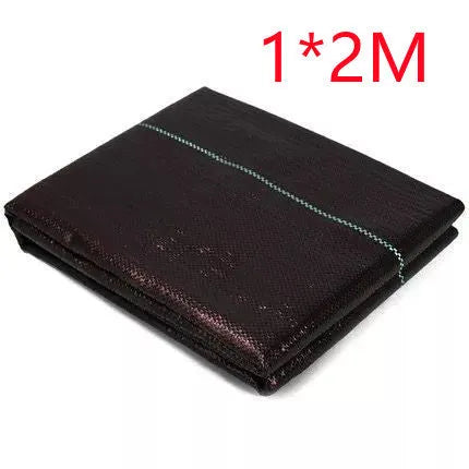 Black polyethylene woven weed-proof cloth laid flat on soil, showing its texture and size options for farmland.