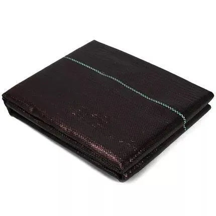 Black polyethylene woven weed-proof cloth laid flat on soil, showing its texture and size options for farmland.