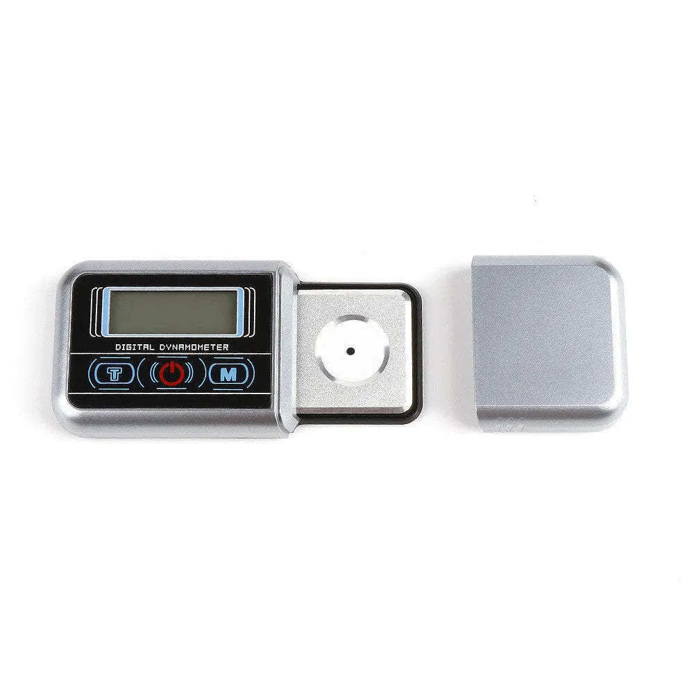 Compact digital electronic scale on a surface, showing a 100g max capacity and 0.005g precision.