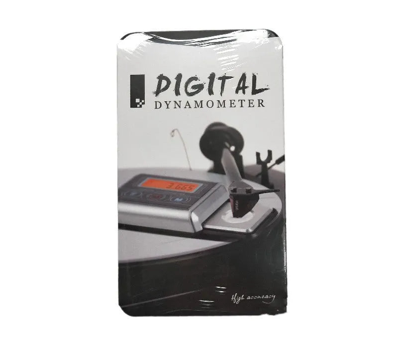 Compact digital electronic scale on a surface, showing a 100g max capacity and 0.005g precision.