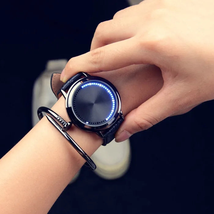 Electronic digital wristwatch with dazzling blue LED screen display and black plastic case and strap