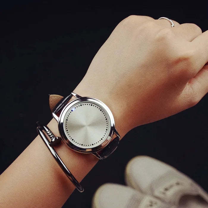 Electronic digital wristwatch with dazzling blue LED screen display and black plastic case and strap