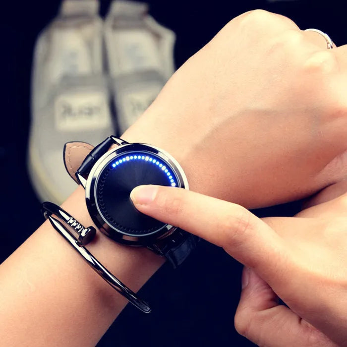 Electronic digital wristwatch with dazzling blue LED screen display and black plastic case and strap