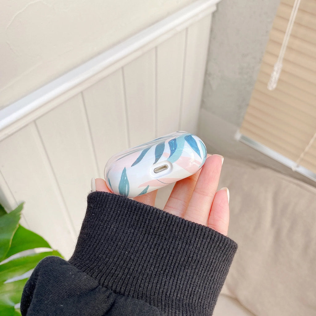 Blue and green banana leaf design TPU protective case for Apple AirPods.