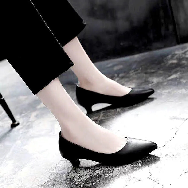 Women's silver and black stiletto wedding shoes with crystal details on a heel.
