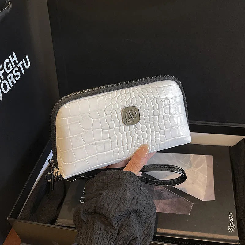 Hand-held Crystal Bamboo Pattern mobile phone bag in black, rectangular shape, 19x5x10cm, PU material, with interior pockets.