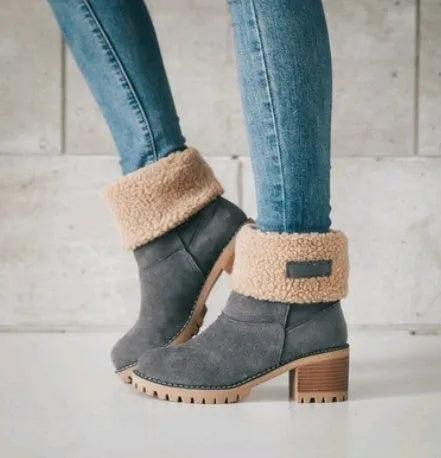 Women's suede mid-calf snow boot in grey with a flat heel and round toe.