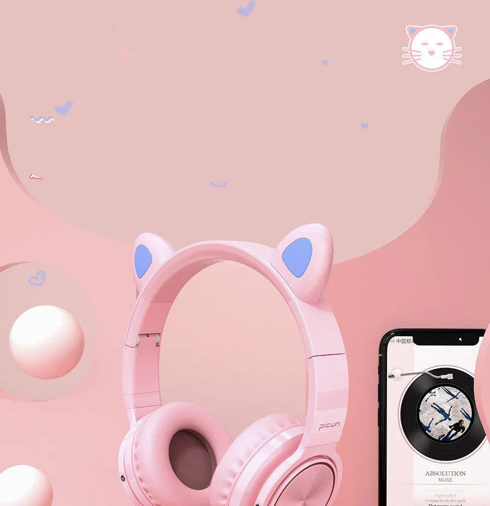 Pink white Luminous Bluetooth over-ear headphones showing protein ear cushions and braided cable.