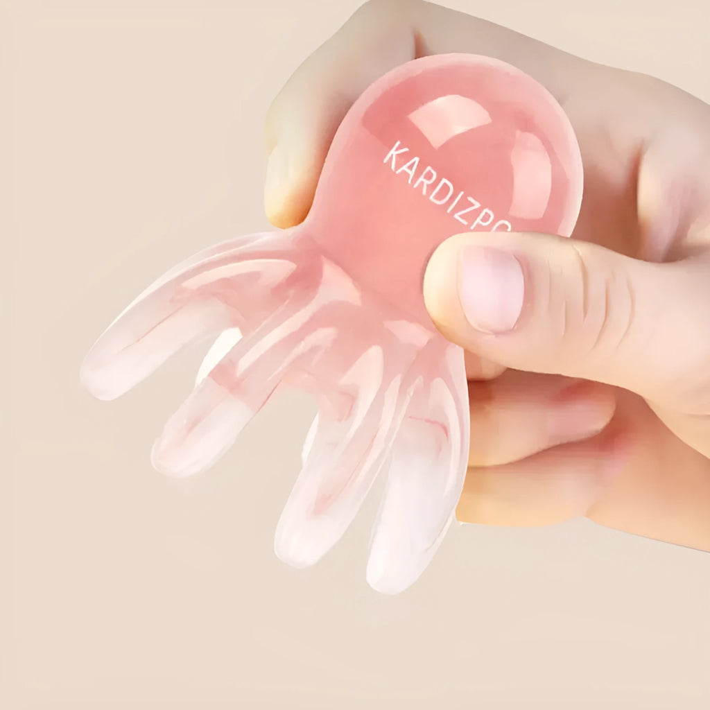 Pink octopus-shaped facial massage comb made from natural resin with eight flexible arms