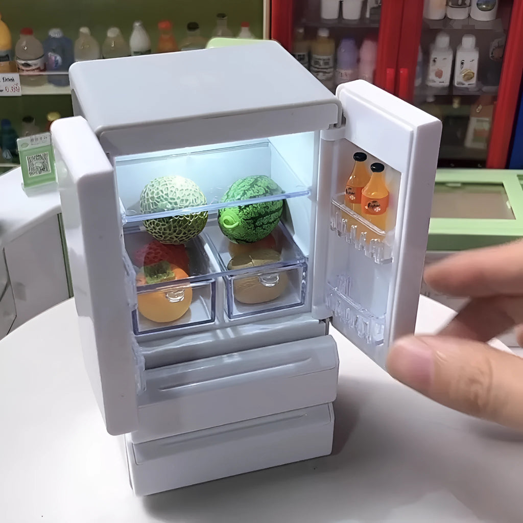 White plastic miniature candy toy model with light-up feature displayed on surface