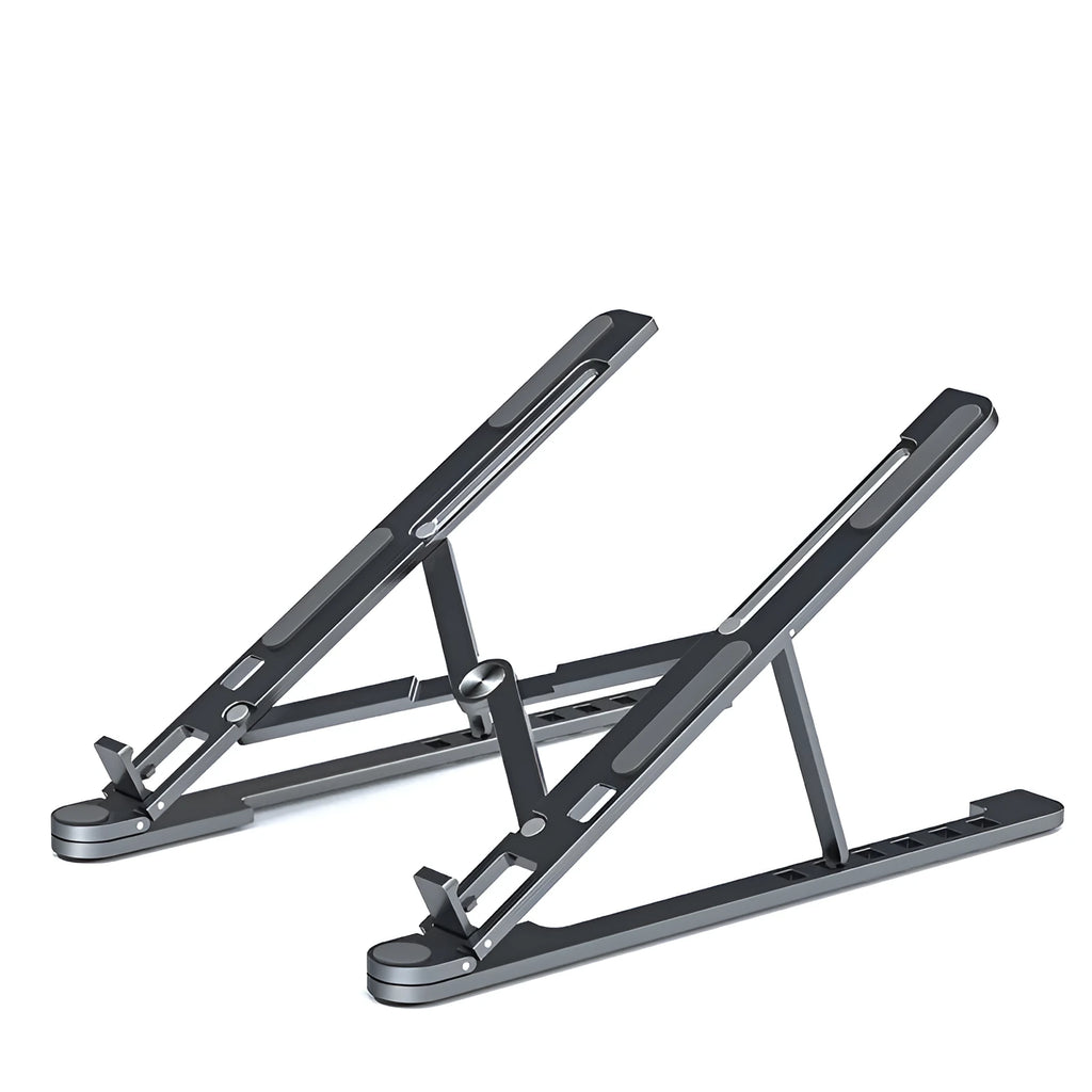 Silver foldable aluminium laptop stand holding a MacBook at an adjustable angle.