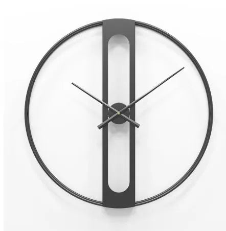 Large 50cm round metal wall clock in black or gold colour on a wall.