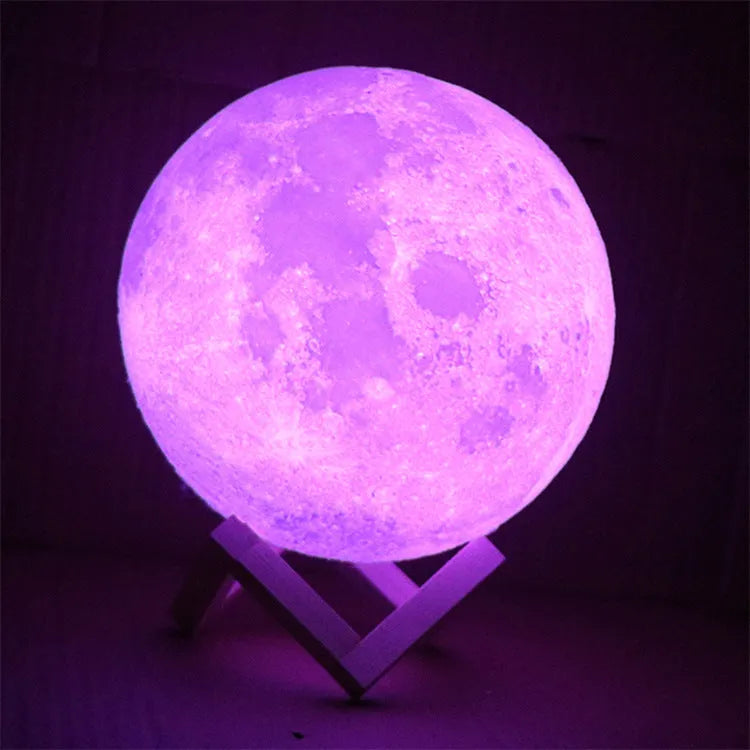 3D printed moon lamp with lunar surface detail on wooden stand, showing touch metal ring at base