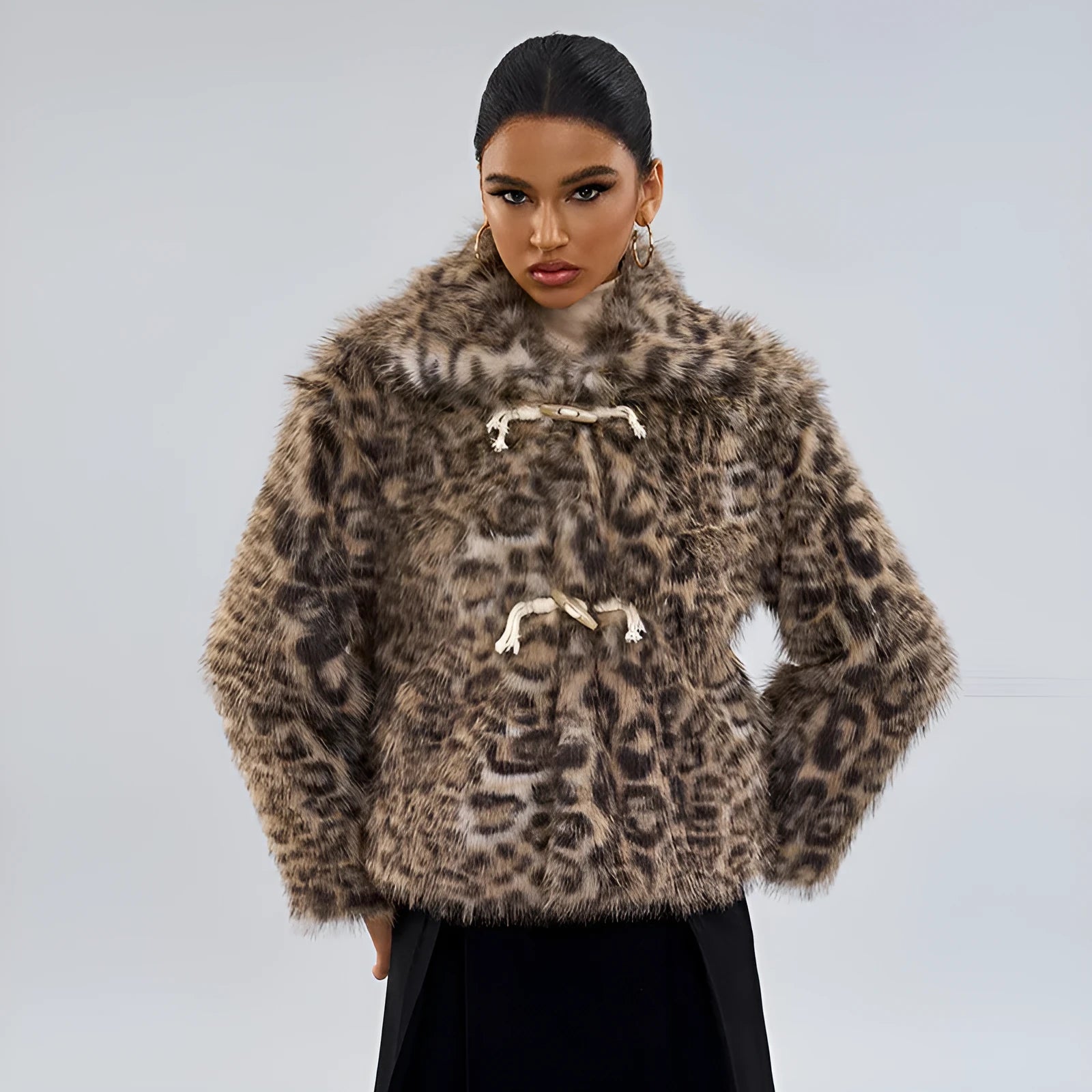 Women's leopard print polyester coat with buckle lapel detail showing regular sleeves and mid-length design