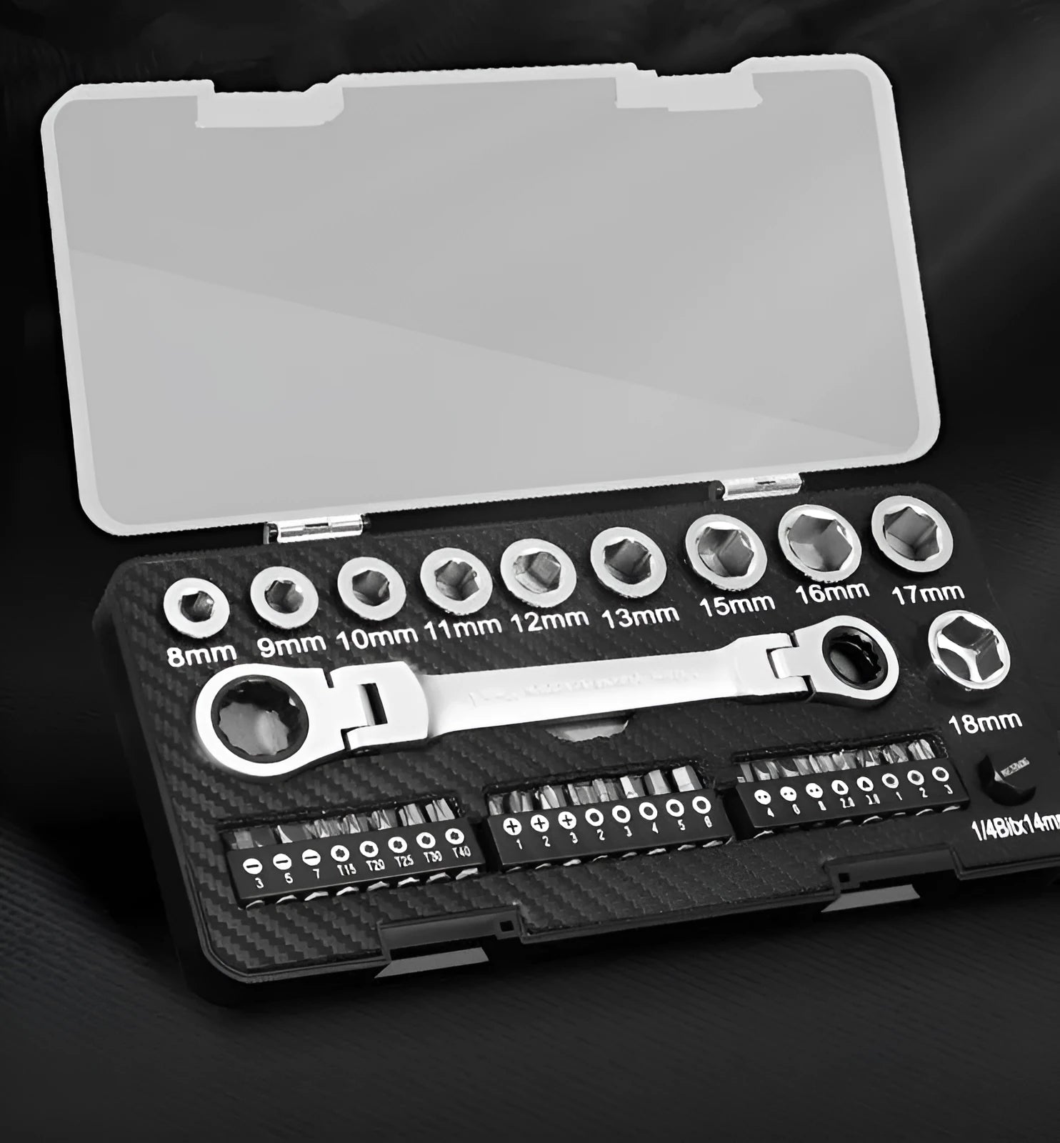 Two-way ratchet wrench with a 1/2 inch drive, surrounded by ten sockets and three batch heads on a workbench.