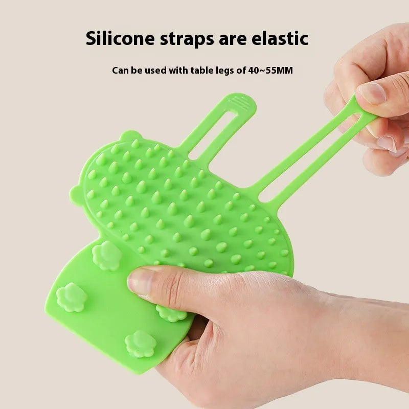 Silicone cat massage comb with rounded teeth and adjustable strap for table legs