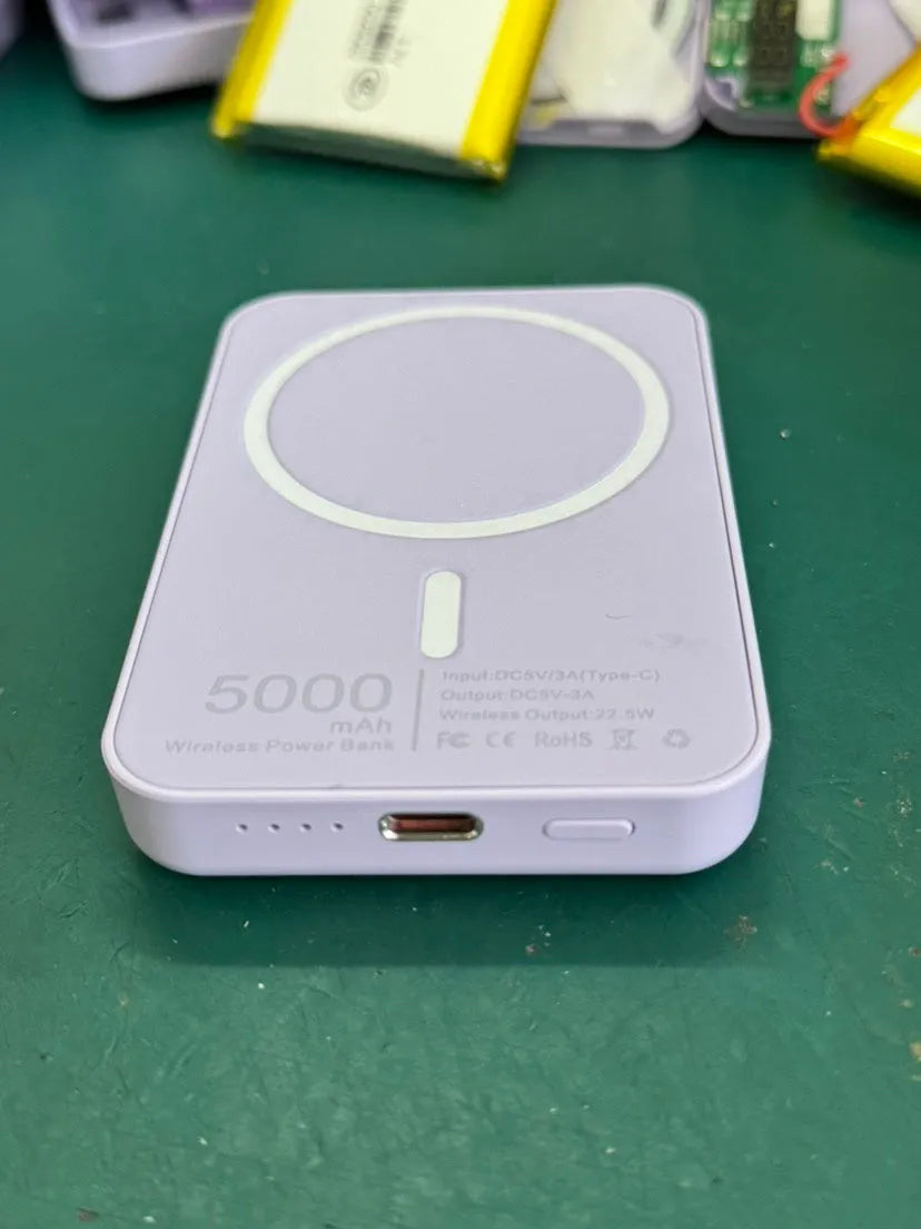 White PVC magnetic wireless charger power bank showing 5000mAh capacity and compact design