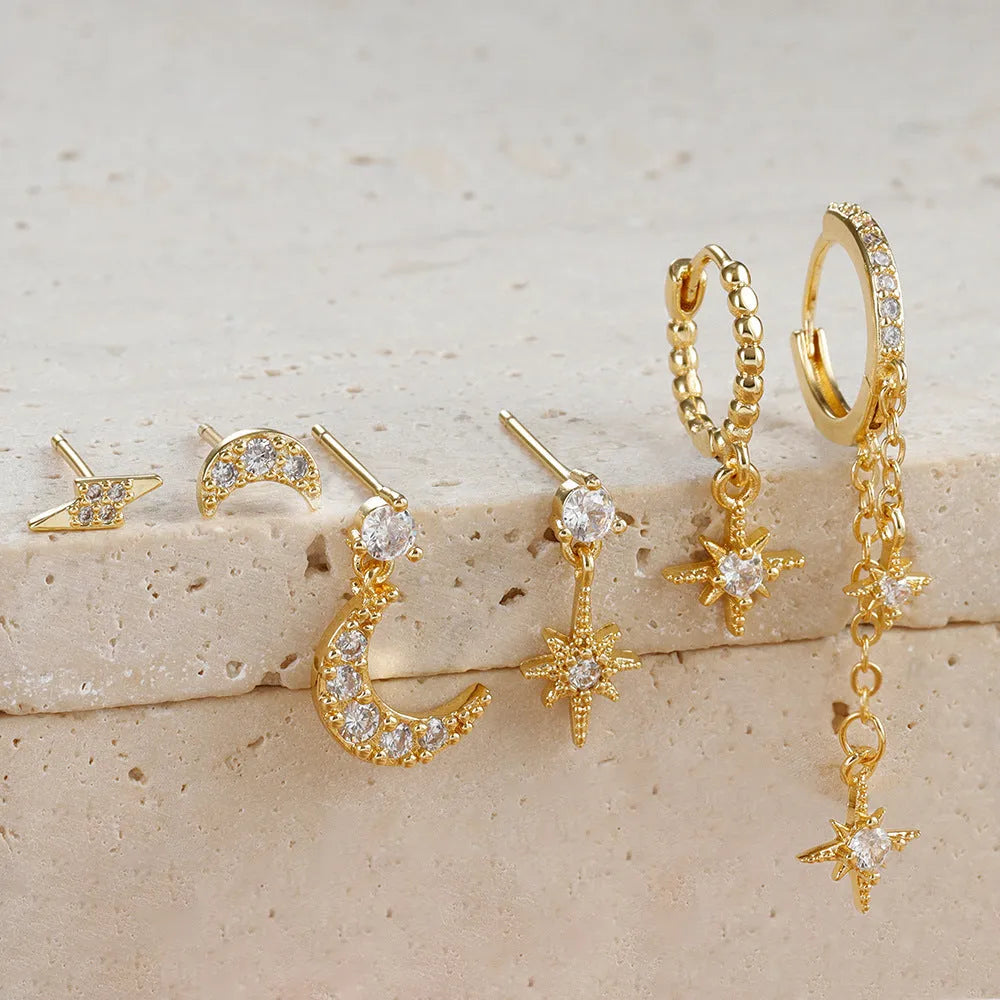 Gold electroplated chain tassel earrings set with six pieces including zircon stud accents