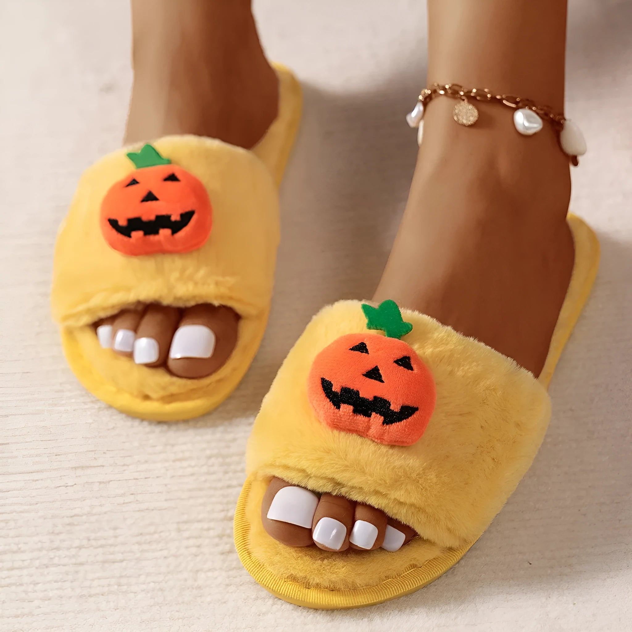 Yellow and white cartoon pumpkin plush slippers with synthetic fur and PVC anti-slip sole.