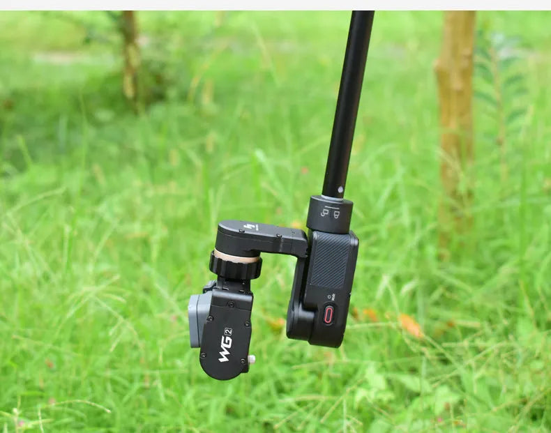Black retractable aluminium selfie stick with hand-held stabiliser and phone grip, shown extended and collapsed.