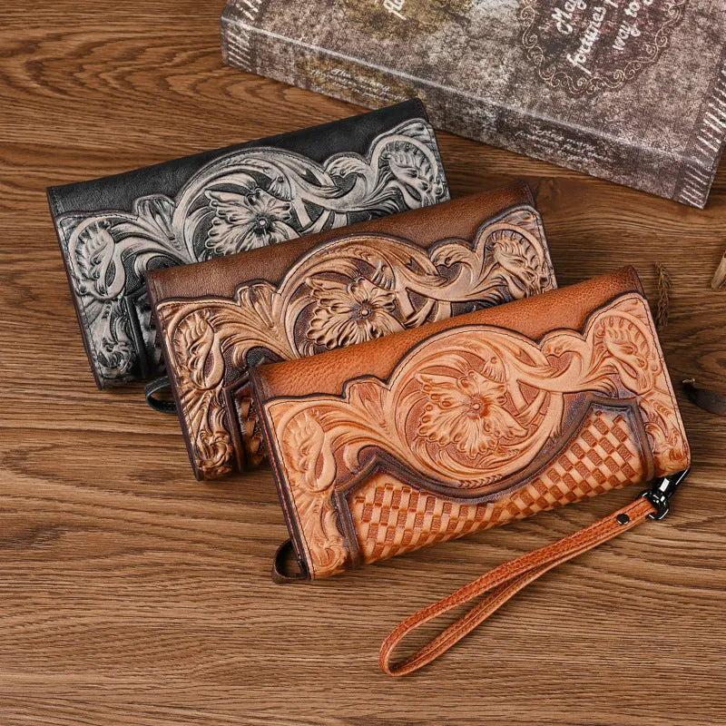 Women's brown tri-fold leather wallet with embossed floral pattern, shown open to reveal compartments.
