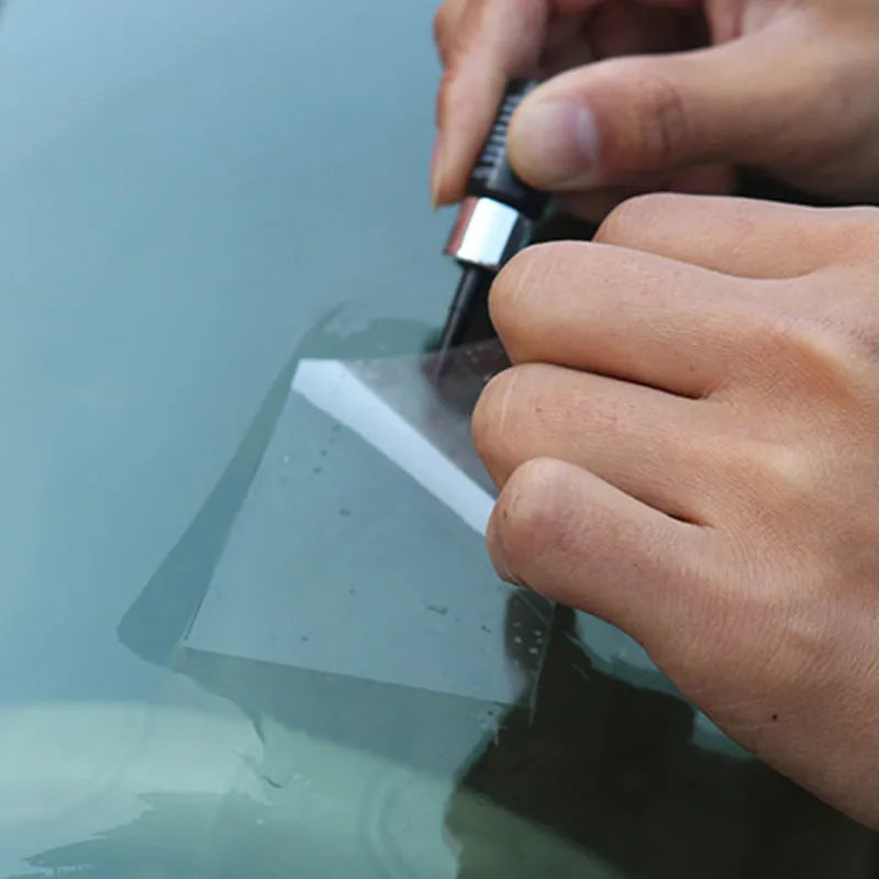Yellow three-piece car windscreen repair kit with glass repair liquid