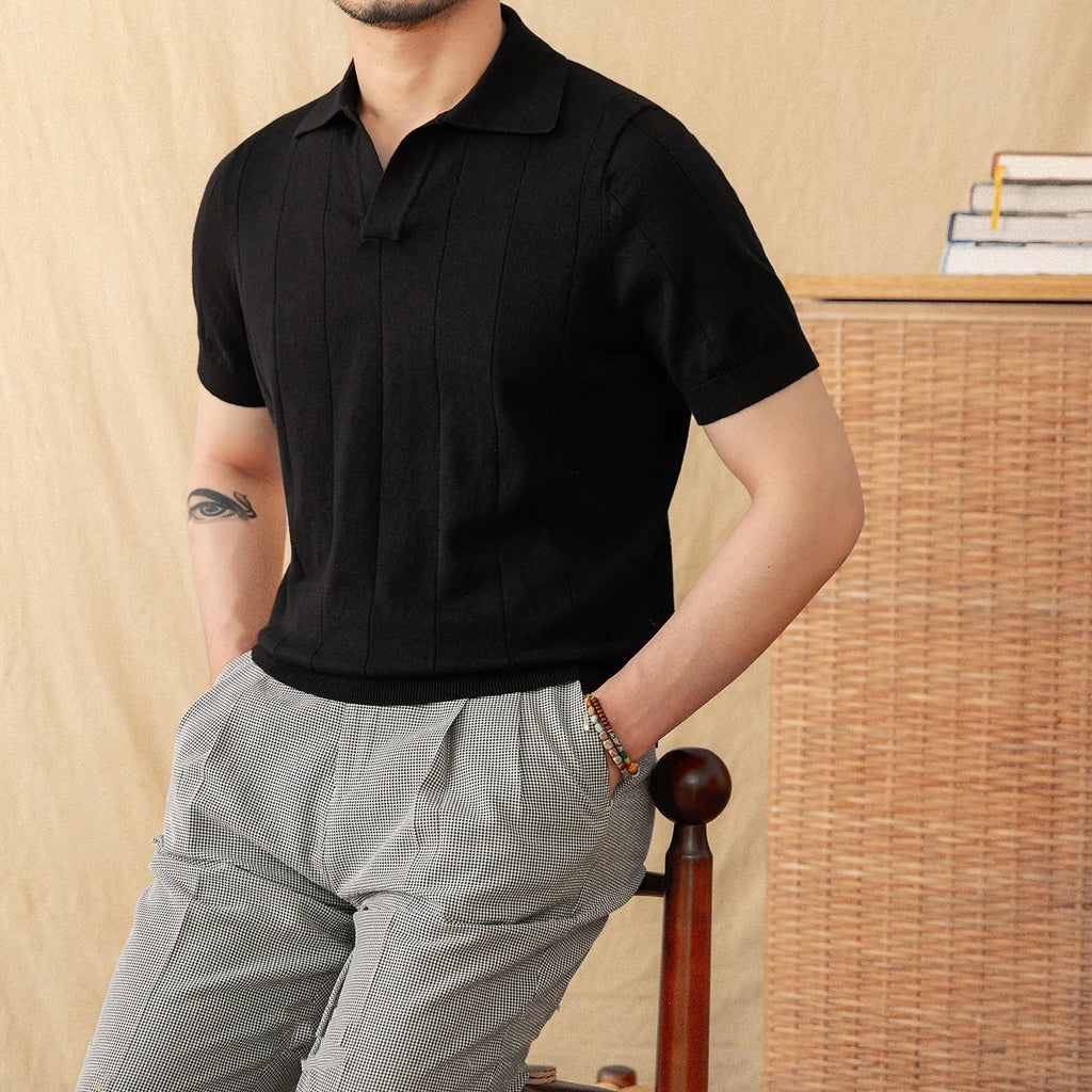 Short sleeve polo top with seagull collar in a textured sunken stripe knit, shown in purple.