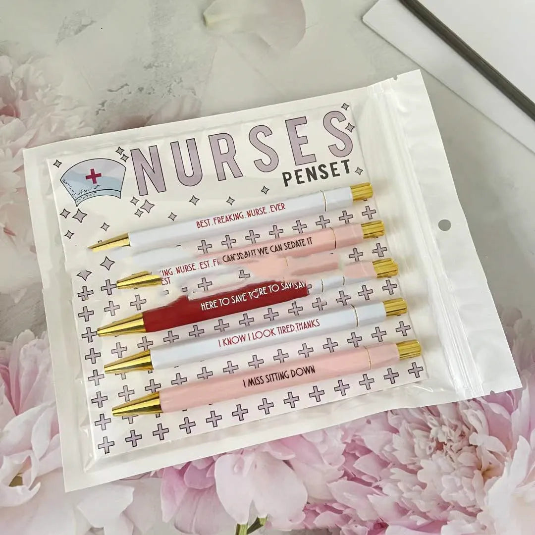 Five nurse-themed plastic ballpoint pens with retractable tips, measuring 14cm in length