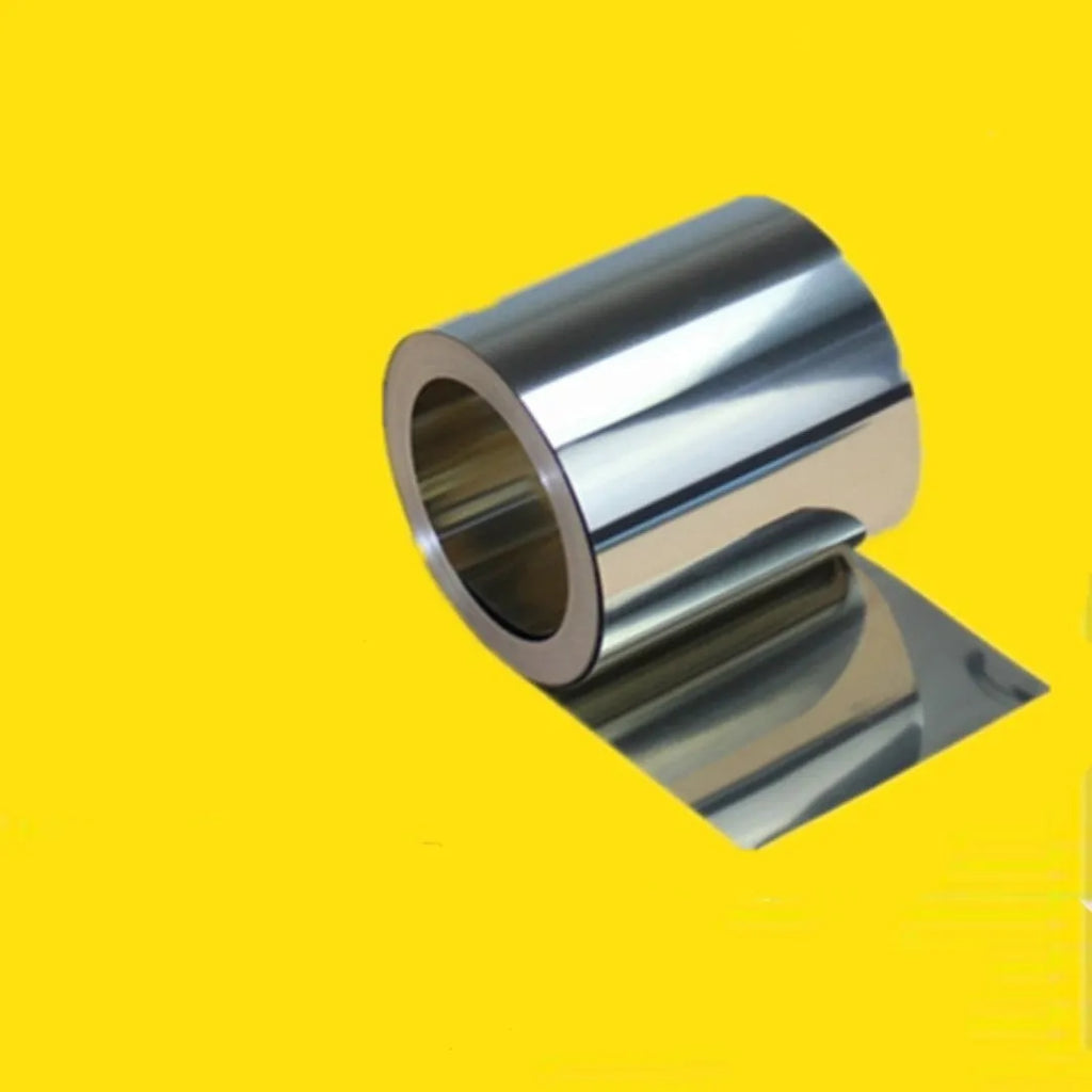 Close-up of a rolled 304 stainless steel strip with leather backing, showing various thickness and width options on a workshop bench.