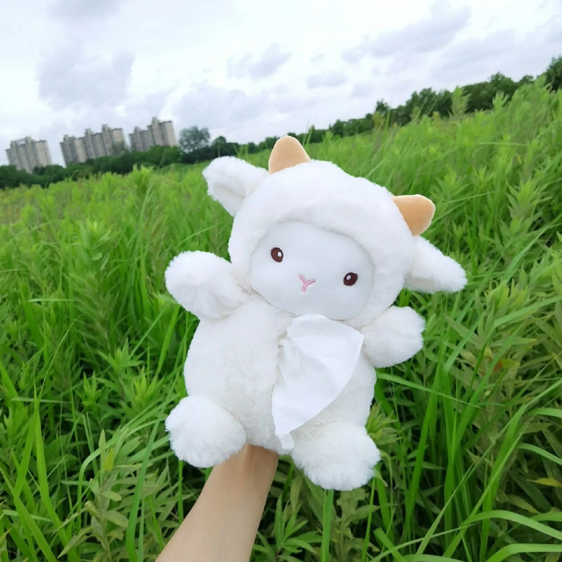 Soft plush cartoon lamb tissue box for car dashboard or home decor.