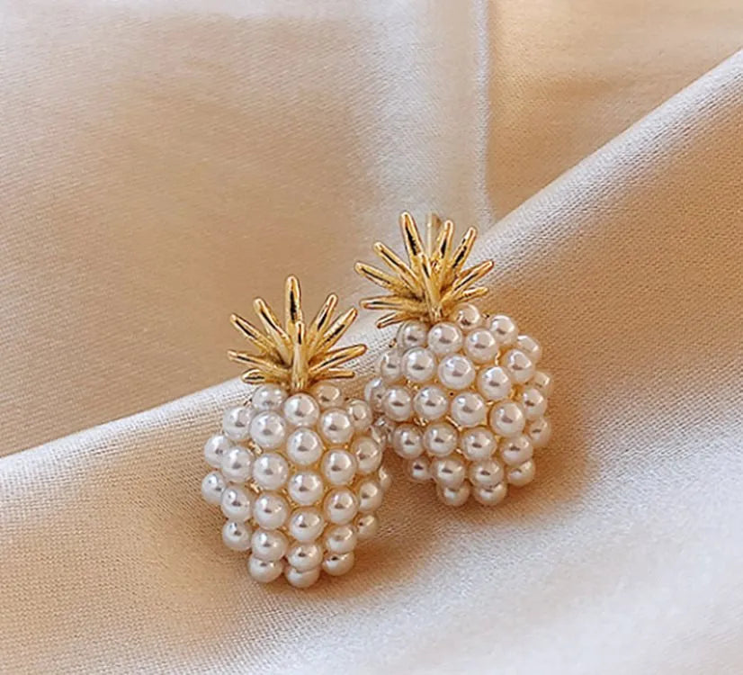 Pineapple and starfish motif drop earrings with pearl and artificial gemstone details on alloy metal