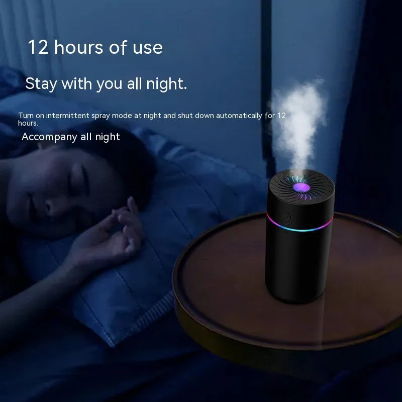Compact white car USB mini humidifier with aromatherapy function positioned in vehicle cup holder