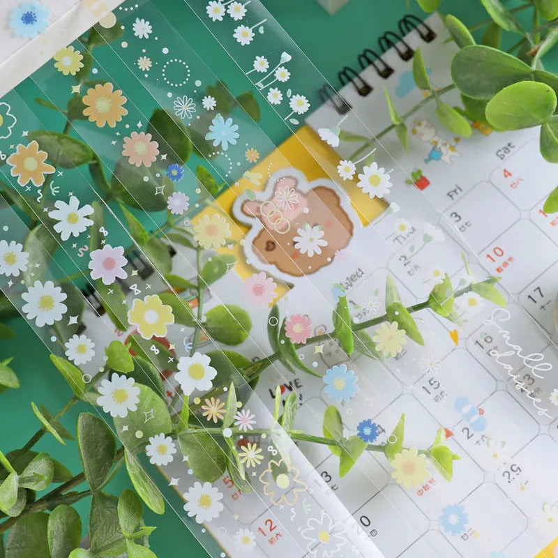 Five rolls of transparent decorative tape with colourful Midsummer Daisy cartoon designs