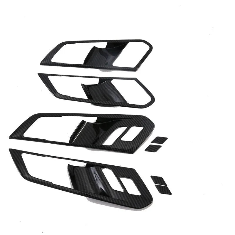 Matte black ABS plastic centre console trim panel for BMW X5 with cup holder and air vent controls.