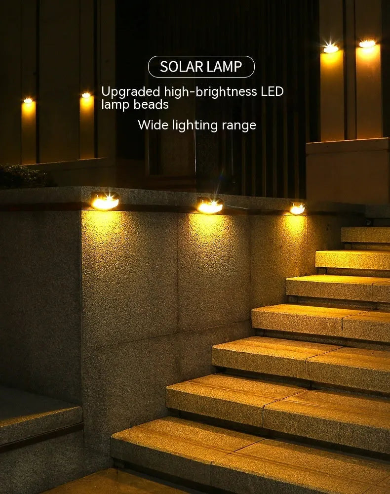 Solar-powered decorative wall lamp with smiling face design for outdoor garden lighting