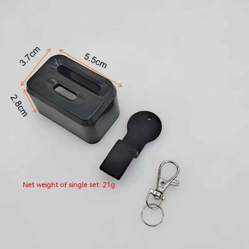 Black and red plastic seat belt buckle protector showing clip-on design.