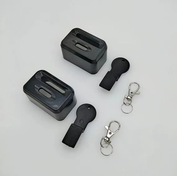 Black and red plastic seat belt buckle protector showing clip-on design.