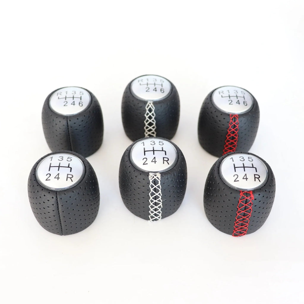Sewn wrapped perforated leather handball gear for Alpha vehicles in Black, Red, and White Line options.