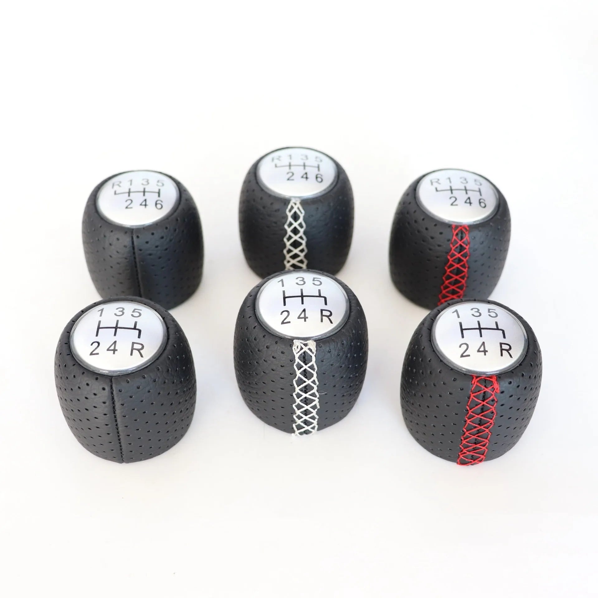 Sewn wrapped perforated leather handball gear for Alpha vehicles in Black, Red, and White Line options.