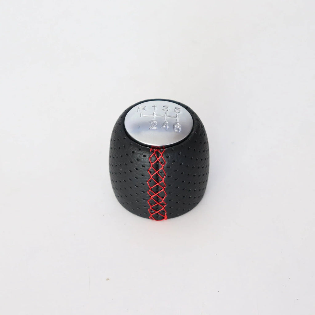 Sewn wrapped perforated leather handball gear for Alpha vehicles in Black, Red, and White Line options.