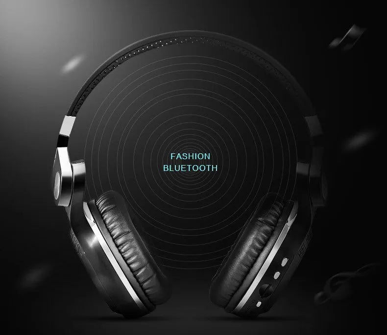 Black Bluetooth earbuds showing card plug-in storage design and separate silicone eartips.